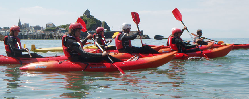 group kayaking on north devon coast