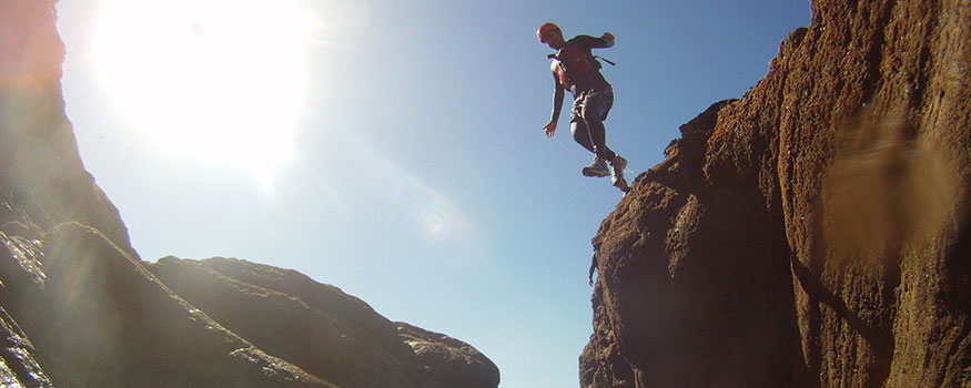 man coasteering in North Devon coast