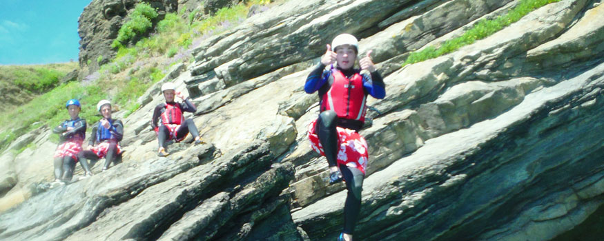 man coasteering in devon