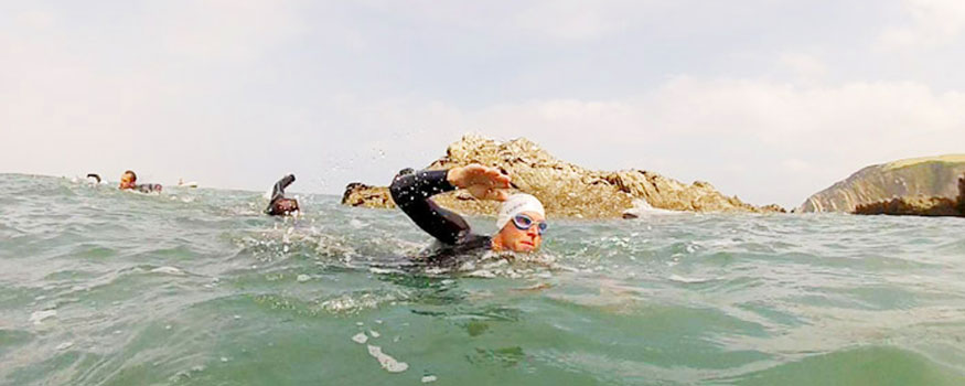 person wild swimming in north devon sea